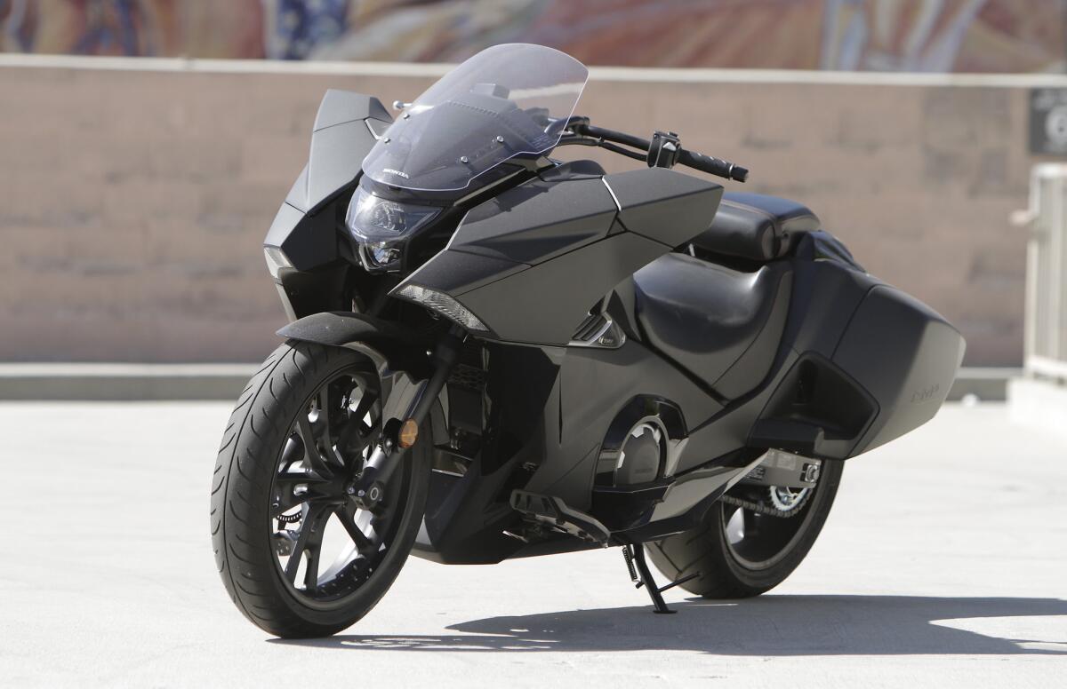 The 2015 Honda NM4 is a futuristic-looking, automatic transmission motorcycle. It's powered by a 670 cc twin-cylinder engine, has ABS-equipped brakes and is priced at $10,999.