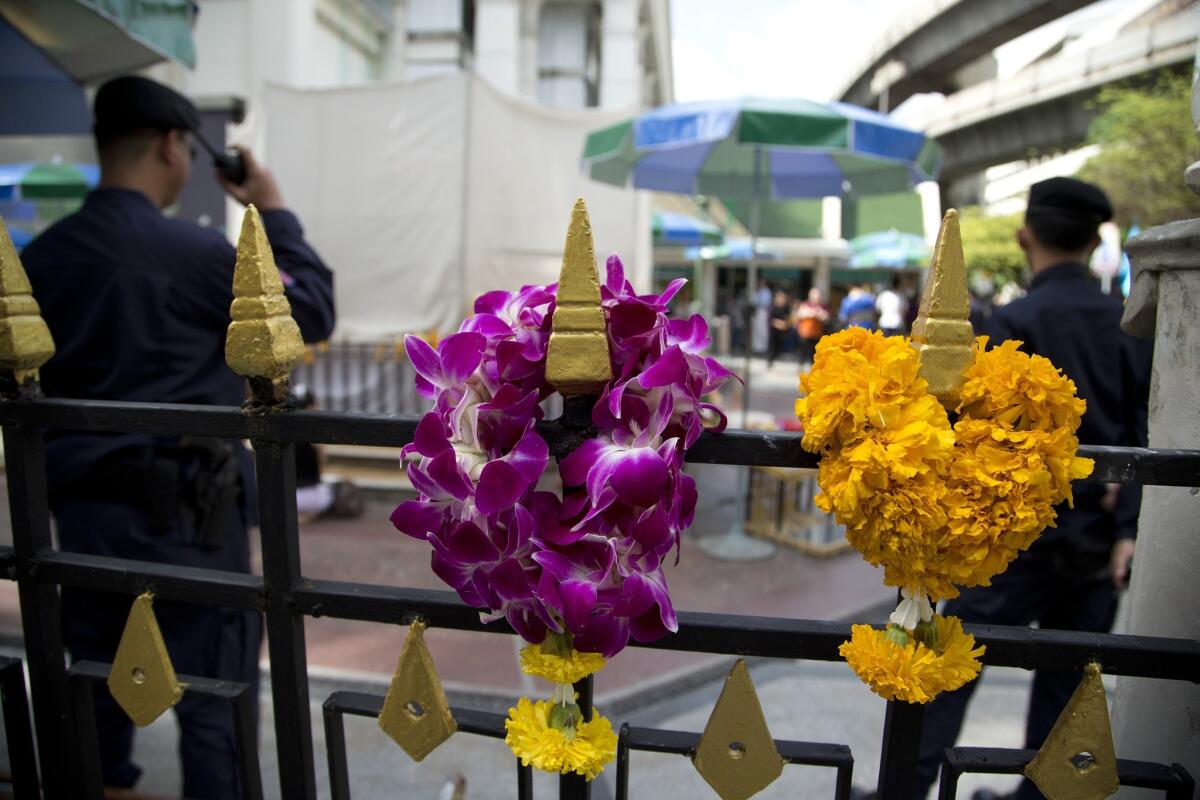 Thai police keep watch at the Erawan Shrine, scene of an Aug. 17 bombing in Bangkok.