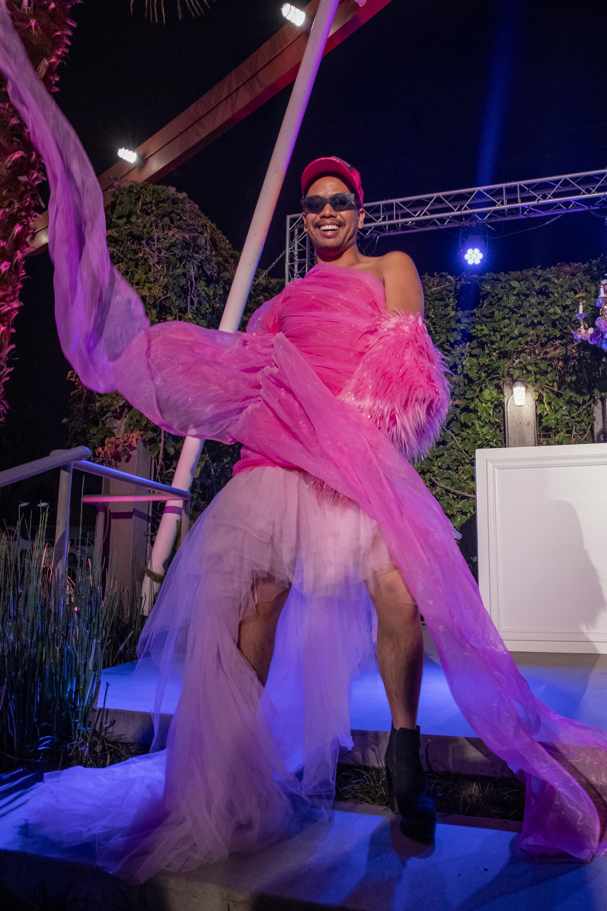 Sir Christopher Saint poses in a pink tule dress