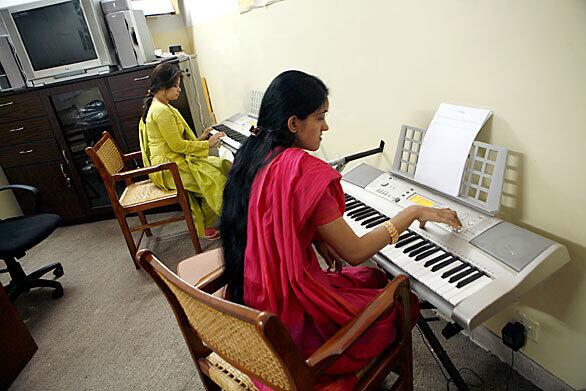 The Punjab University music department is now housed in the basement of a building off campus after militant groups threatened the department. Two students practice the keyboard in the basement. The cultural society of Lahore, and other cities of Pakistan, has fallen victim to the rise in Islamic extremism. Concerts and art shows rarely take place for reasons that include fear of being targeted by suicide bombers.