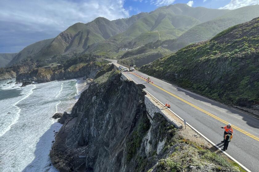 This photo provided by Caltrans shows a damaged section of Highway 1, Sunday, March 31, 2024, south of Rocky Creek Bridge in Big Sur, Calif. Authorities urged motorists to avoid the scenic highway after a section of the coastal route collapsed during an Easter weekend storm, forcing closures and stranding motorists near Big Sur, authorities said. (Caltrans District 5 via AP)