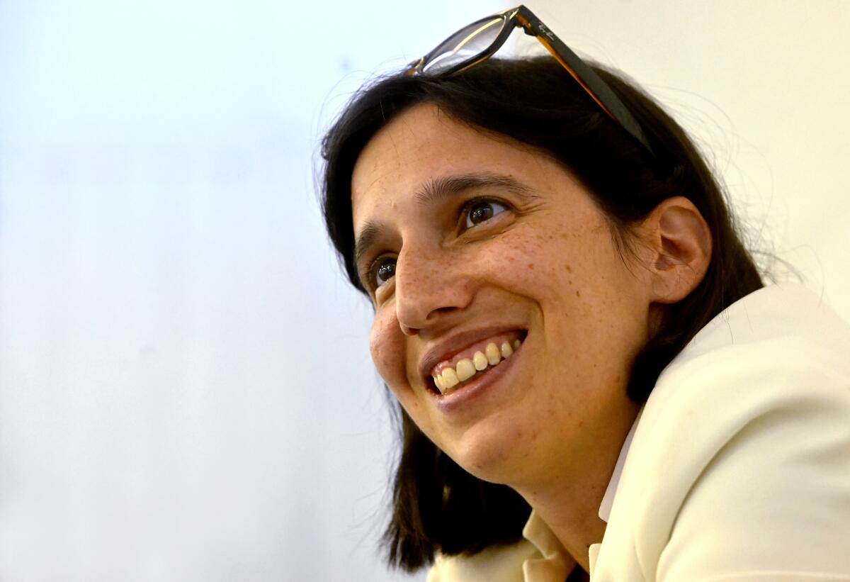 Elly Schlein, an independent candidate who runs with the Democratic Party, smiles during an interview with the Associated Press in Modena, Italy, Friday, Sept. 2, 2022. Schlein, a 37-year-old U.S.-Italian national, often compared with U.S. Rep. Alexandria Ocasio-Cortez for her platform advocating social justice is on the road in a national campaign aimed at challenging the overriding storyline that the united right will easily defeat the left in the Sept. 25 vote. (AP Photo/Marco Vasini)