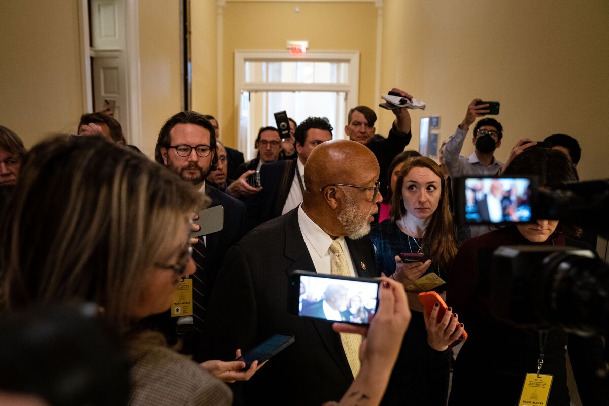 Rep. Bennie Thompson, center, surrounded by journalists as he departs a meeting
