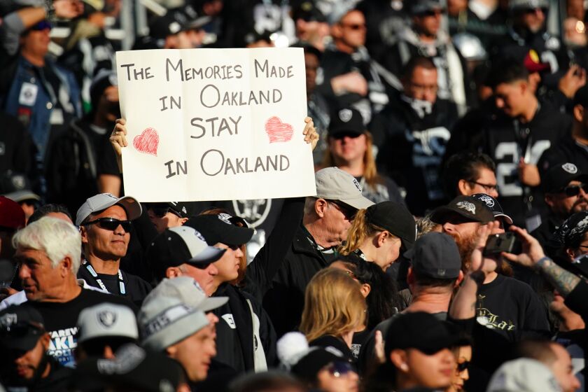 OAKLAND, CALIFORNIA - DECEMBER 15: An Oakland Raiders fan in the stands holds a sign during the second half against the Jacksonville Jaguars at RingCentral Coliseum on December 15, 2019 in Oakland, California. (Photo by Daniel Shirey/Getty Images)