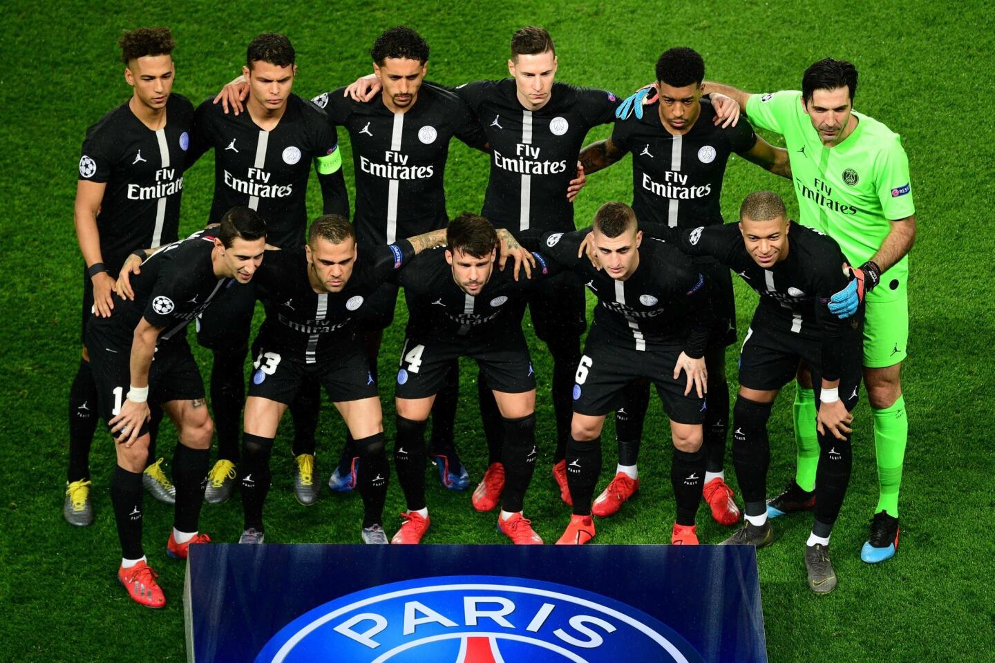 Paris Saint-Germain's players pose for a team picture prior to the UEFA Champions League round of 16 second-leg football match between Paris Saint-Germain (PSG) and Manchester United at the Parc des Princes stadium in Paris on March 6, 2019: (Front row from L to R) Paris Saint-Germain's Argentine midfielder Angel Di Maria, Paris Saint-Germain's Brazilian defender Dani Alves, Paris Saint-Germain's Spanish defender Juan Bernat, Paris Saint-Germain's Italian midfielder Marco Verratti, Paris Saint-Germain's French forward Kylian Mbappe (back row from L to R) Paris Saint-Germain's German defender Thilo Kehrer, Paris Saint-Germain's Brazilian defender Thiago Silva, Paris Saint-Germain's Brazilian defender Marquinhos, Paris Saint-Germain's German midfielder Julian Draxler, Paris Saint-Germain's French defender Presnel Kimpembe and Paris Saint-Germain's Italian goalkeeper Gianluigi Buffon. (Photo by Martin BUREAU / AFP)MARTIN BUREAU/AFP/Getty Images ** OUTS - ELSENT, FPG, CM - OUTS * NM, PH, VA if sourced by CT, LA or MoD **