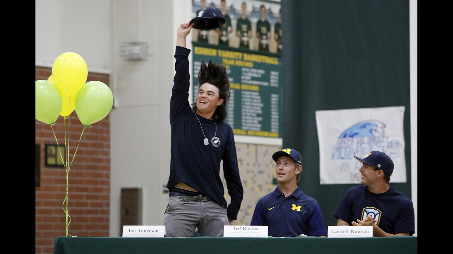 Ian Anderson removes his hat as he is introduced during a signing day ceremony at Edison High on Thursday.