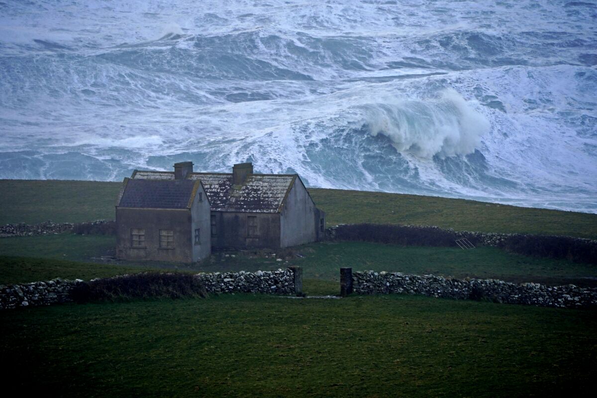 Waves crash against the shore at Doolin in County Clare on the west coast of Ireland.