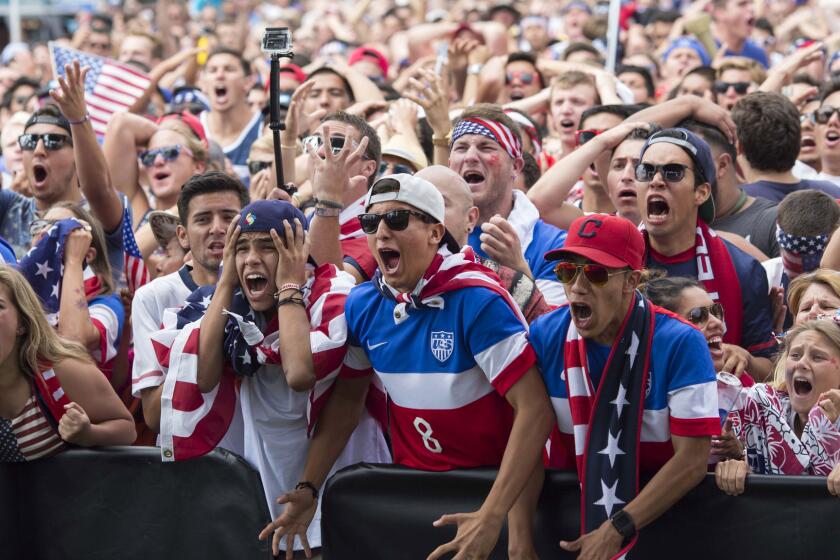 U.S. fans in Redondo Beach react during the American soccer team's loss to Belgium on Tuesday.