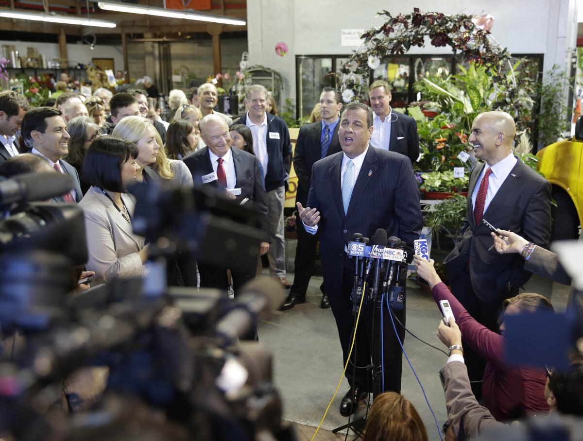 New Jersey Gov. Chris Christie campaigns in San Francisco for California GOP gubernatorial candidate Neel Kashkari, right. He disagreed with Texas Gov. Rick Perry's comparison of homosexuality with alcoholism.