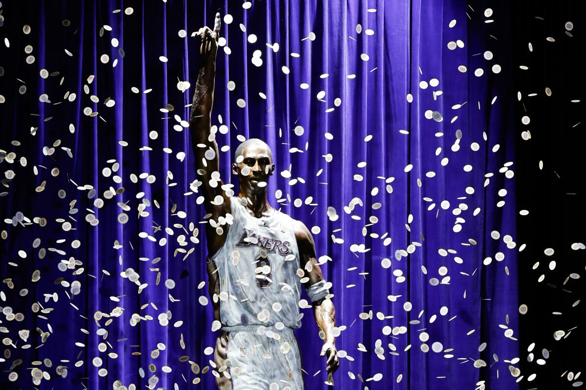 Confetti surrounds a statue honoring the late Kobe Bryant 