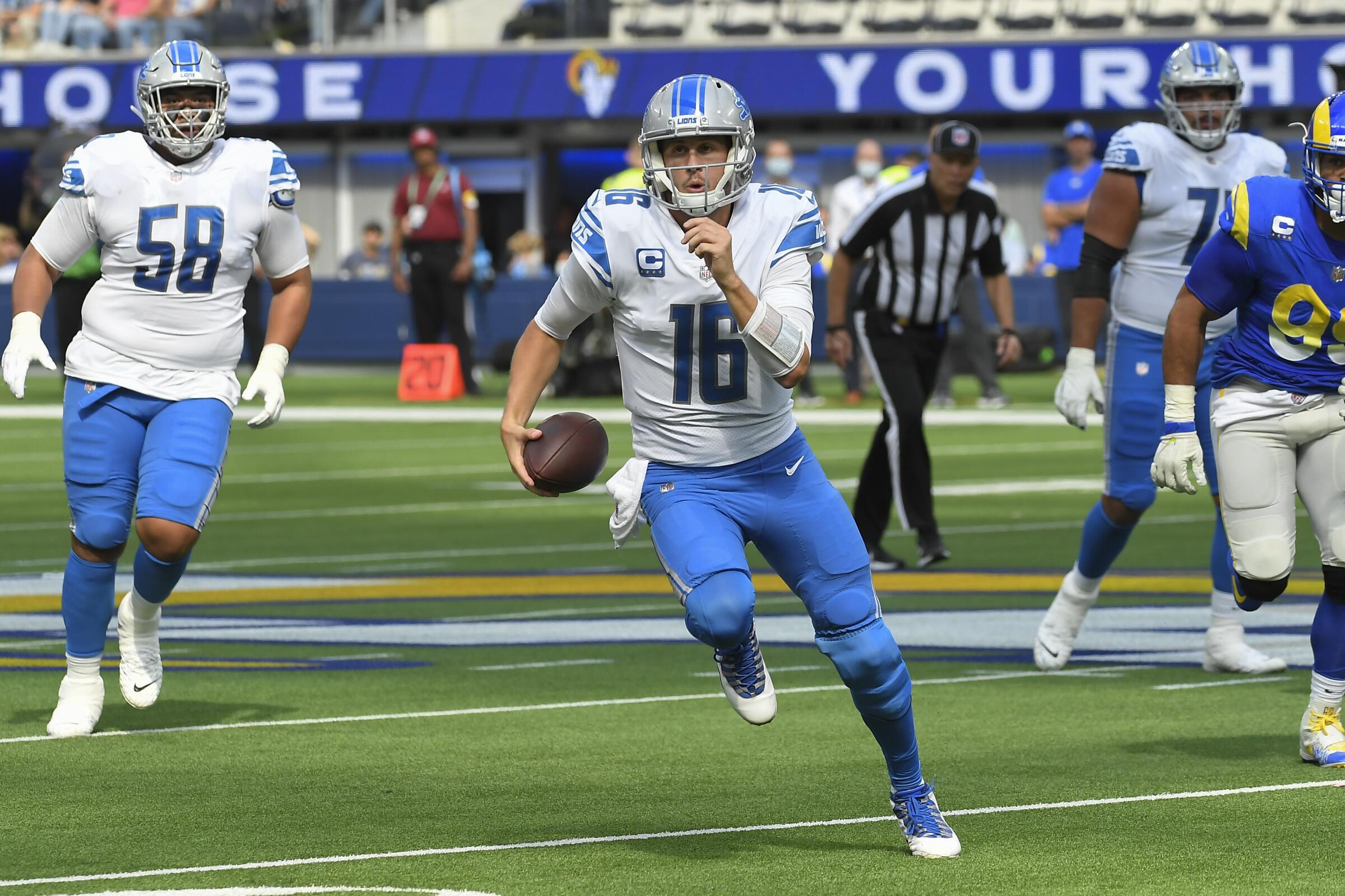 Lions quarterback Jared Goff runs against the Rams in 2021.