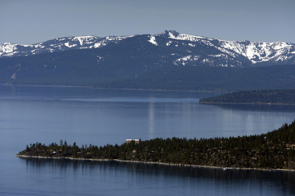 A view of snow-capped mountains, Lake Tahoe, and the historic Cal-Neva Resort & Casino.