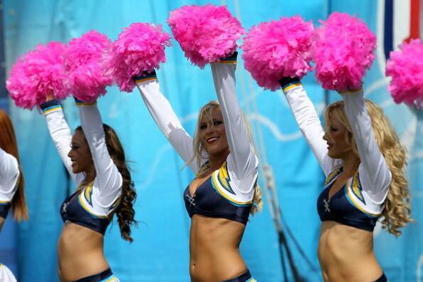 The Charger Girls cheerleader team performs with pink pompoms to acknowledge breast cancer awareness during the game between the Miami Dolphins and the San Diego Chargers at Qualcomm Stadium in San Diego, California. The Chargers won 26-16.