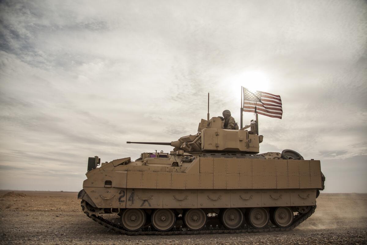 U.S. soldiers driving a Bradley fighting vehicle