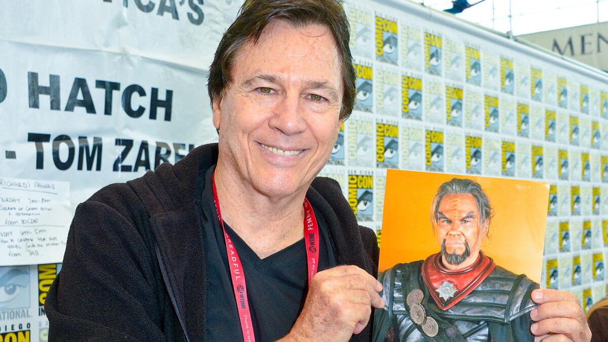Actor Richard Hatch signs autographs of himself dressed as a Klingon in the fan film "Star Trek Axanar" at Comic-Con.