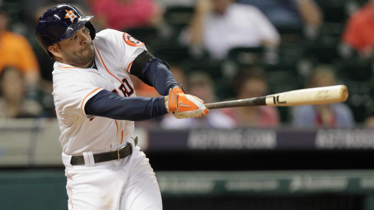 Houston's Jose Altuve hits a double during the eighth inning of the Angels' 8-3 loss Tuesday.