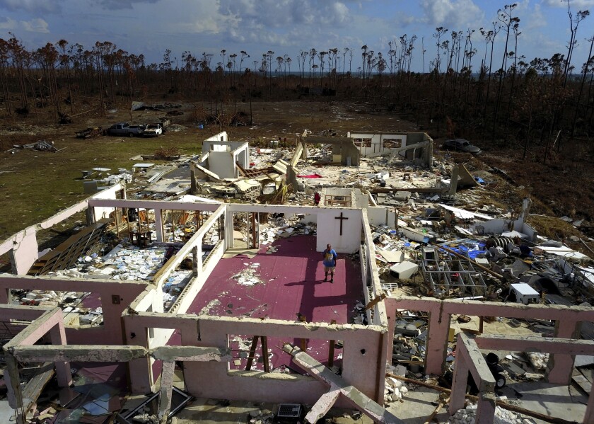 Pastor Jeremiah Saunders stands among the ruins of his church that was destroyed by Hurricane Dorian in High Rock on the island of Grand Bahama on Sept. 11.