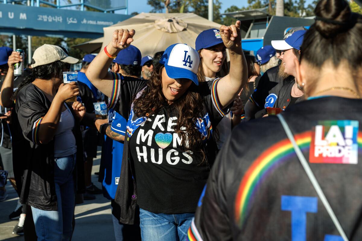 Dodgers fans dance to music during Pride Night at Dodger Stadium.