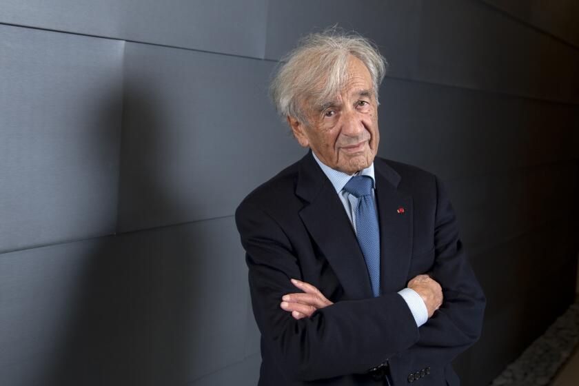 Elie Wiesel, a Distinguished Presidential Fellow at Chpaman University in Orange, is shown there in 2013.