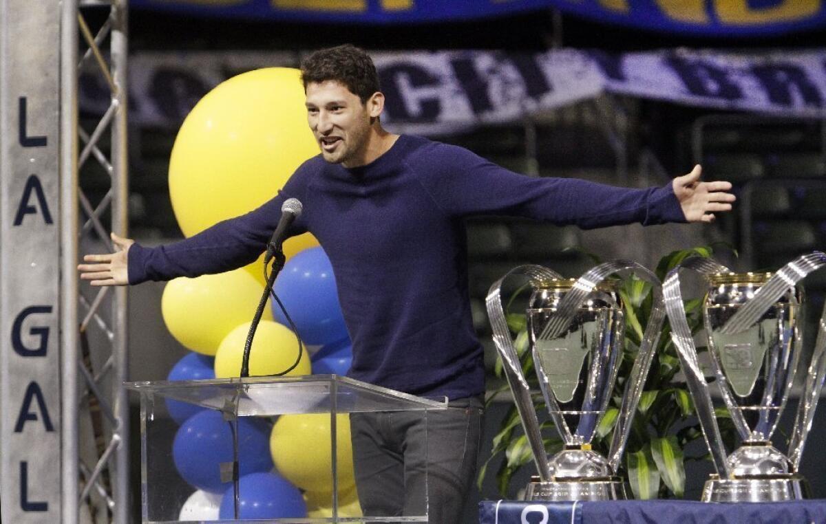 Galaxy defender Omar Gonzalez acknowledges the crowd during a celebration of the team's MLS Cup victory.