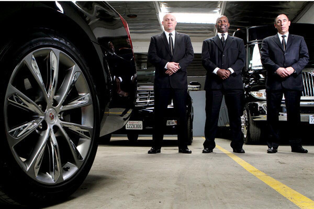 Executive chauffeurs Reggie Colwell, Darrell Hollinquest, and Christopher Smith, from left, at the KLS Worldwide Chauffeur Services office in Van Nuys.
