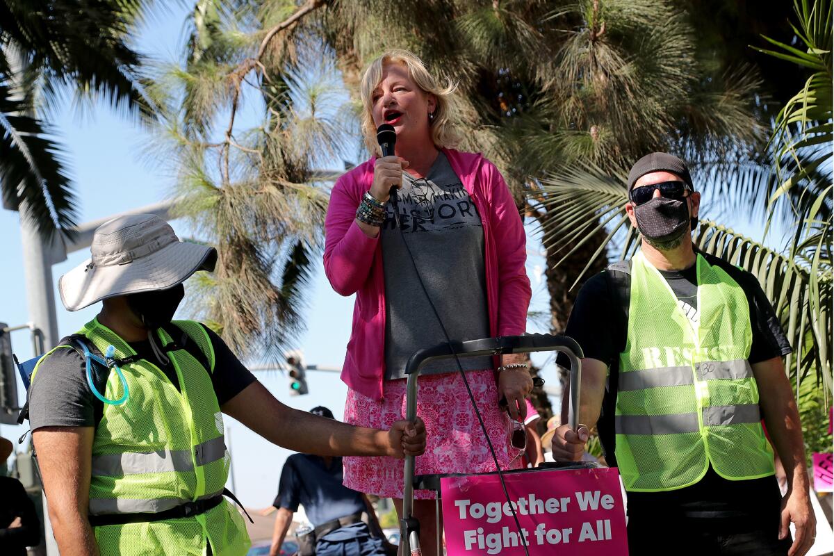 Orange County Supervisor Katrina Foley speaks at the Fountain Valley Women's March on Saturday at Mile Square Park.