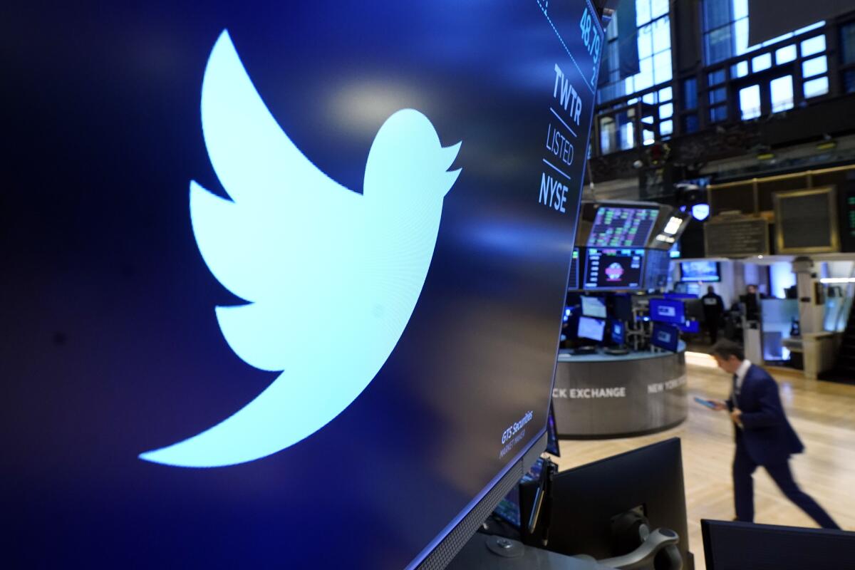FILE - The logo for Twitter appears above a trading post on the floor of the New York Stock Exchange, Nov. 29, 2021. Twitter claims in a lawsuit filed Tuesday, July 12, 2022, in Delaware, that Musk's “outlandish” and “bad faith” actions have caused the social media platform irreparable harm and sank its stock price. (AP Photo/Richard Drew, File)