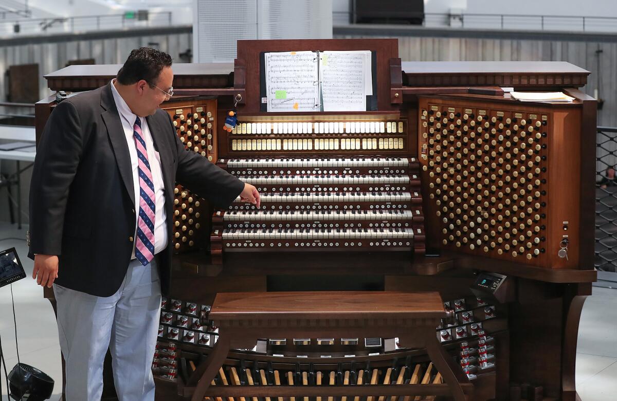 Cathedral organist and Head of Music Ministry David Ball explains the power of the Hazel Wright Organ by pressing a note.