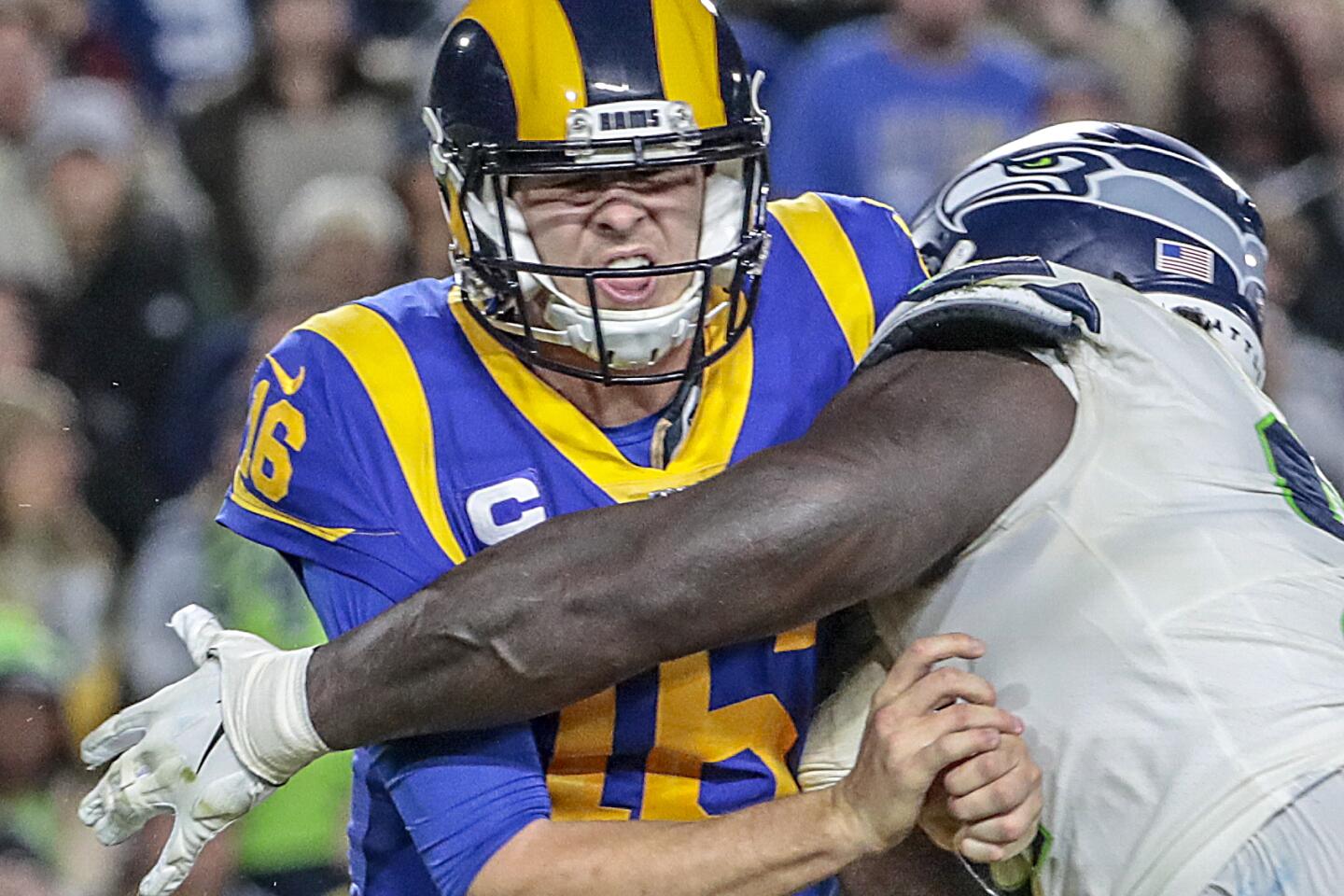 Rams quarterback Jared Goff is hit by Seattle Seahawks defensive tackle Jarran Reed.