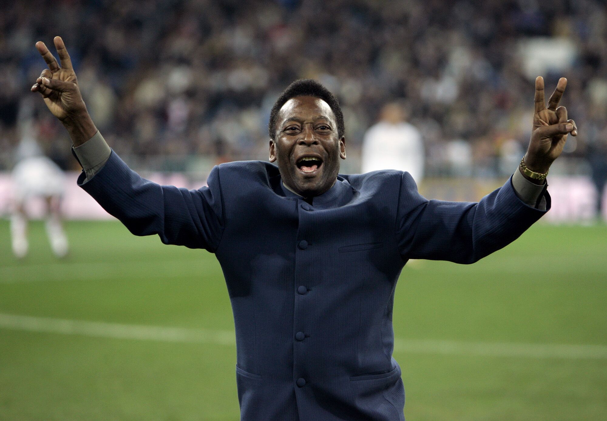 Brazil's soccer legend Pele greets the crowd ahead of a Spanish league soccer match.