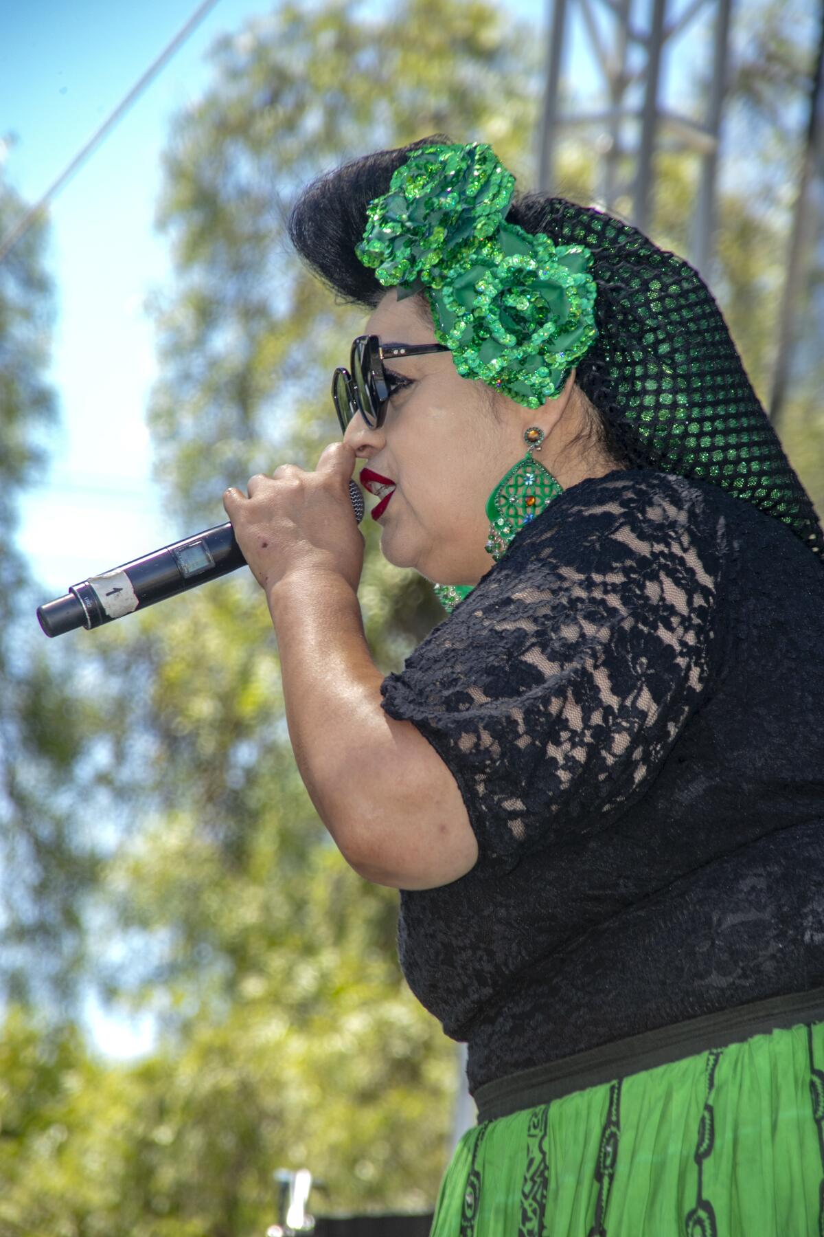 Vicky Tafoya sings along with the Big Beat band at the Chicano Heritage Festival.