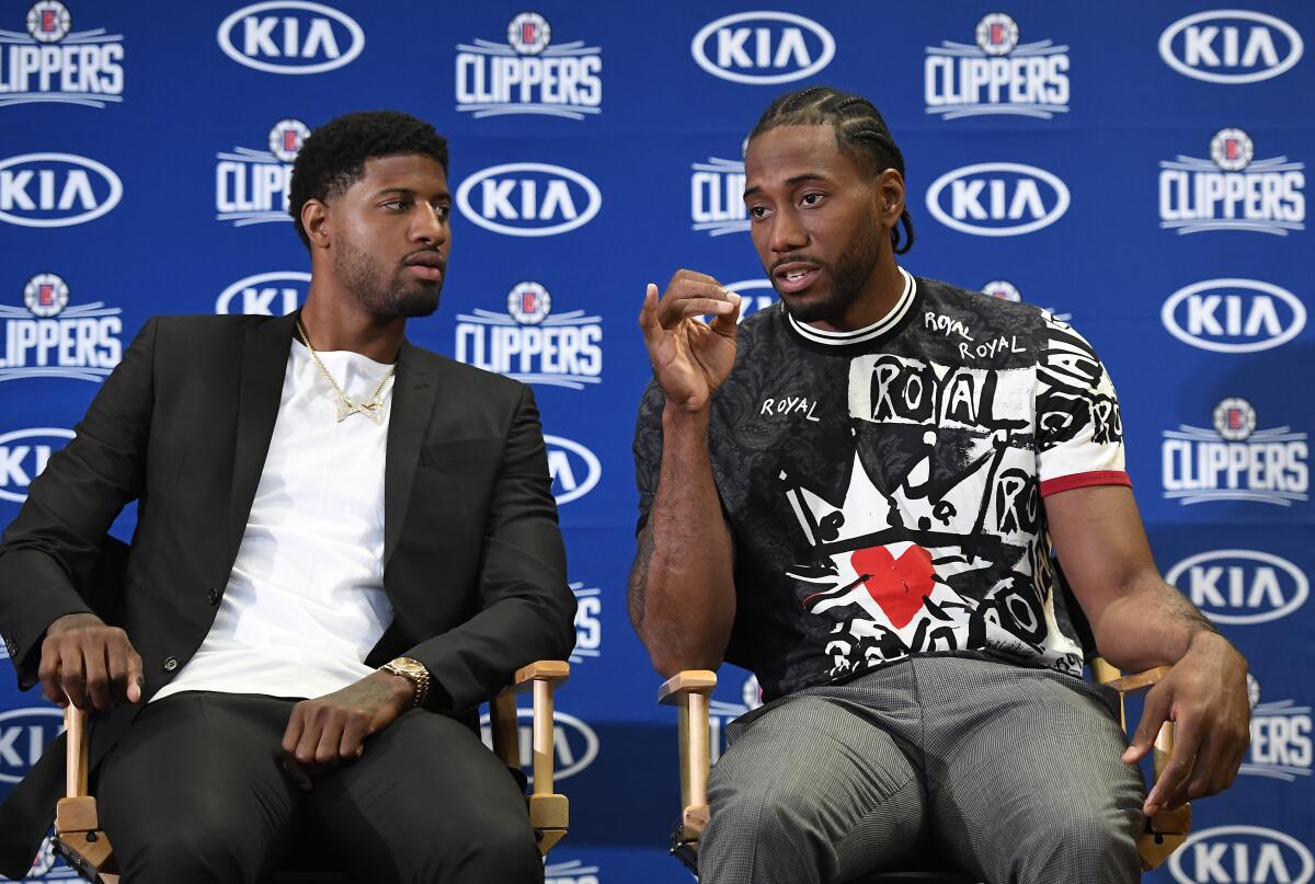 Paul George, left, and Kawhi Leonard are expected to play together Wednesday.