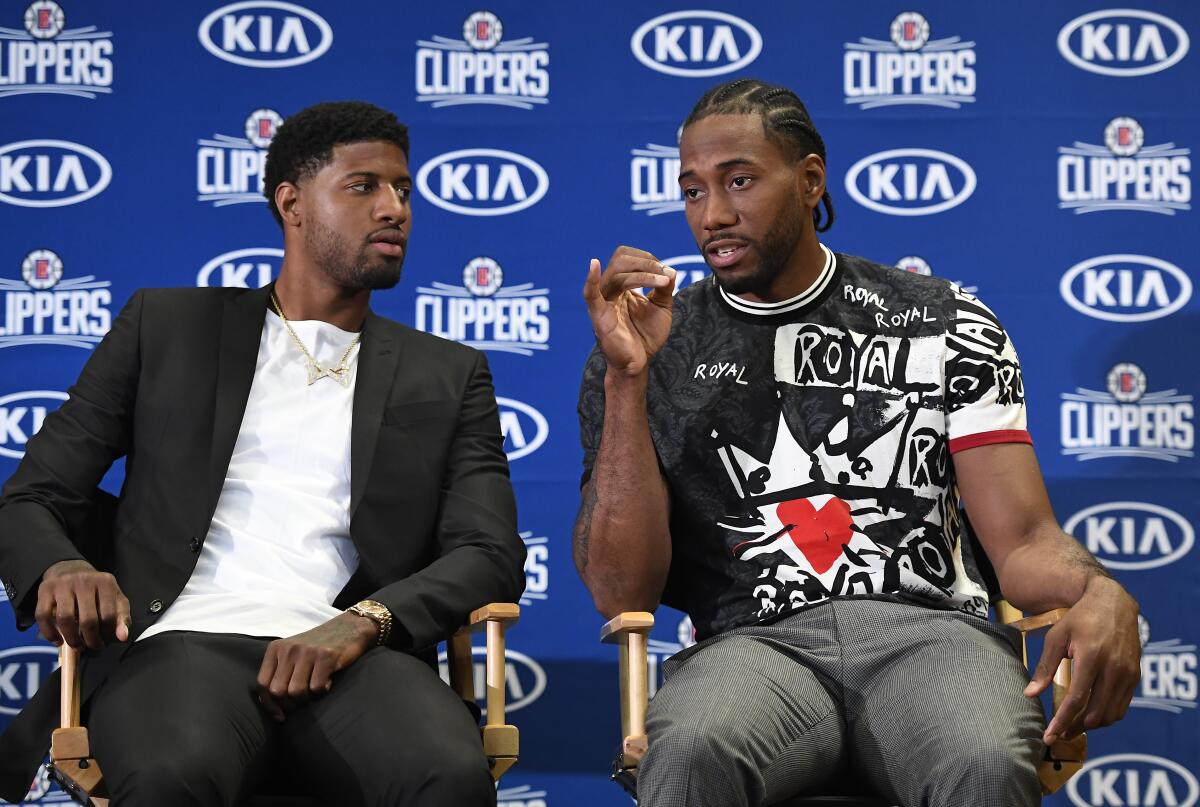 The Clippers introduce Kawhi Leonard and Paul George.