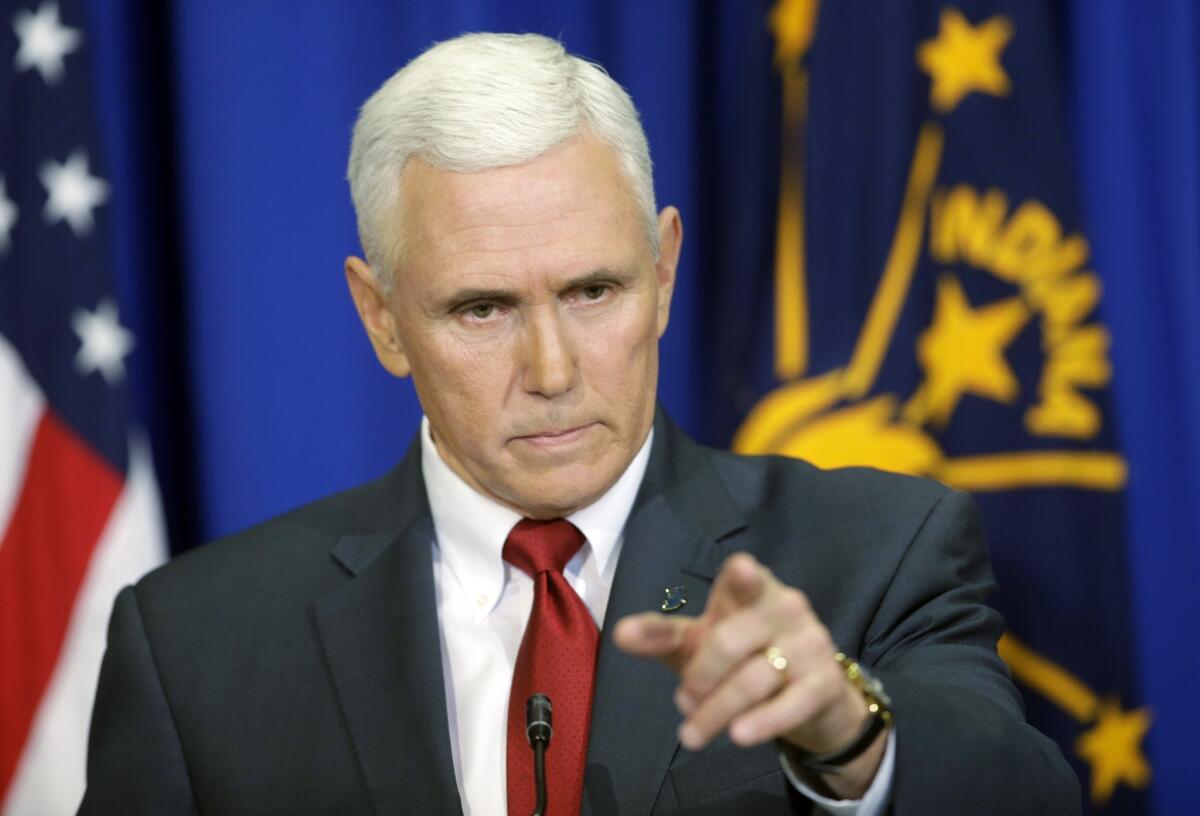 Indiana Gov. Mike Pence takes a question during a news conference Tuesday in Indianapolis. Pence said that he wants legislation on his desk by the end of the week to clarify that the state's new religious-freedom law does not allow discrimination against gays and lesbians.