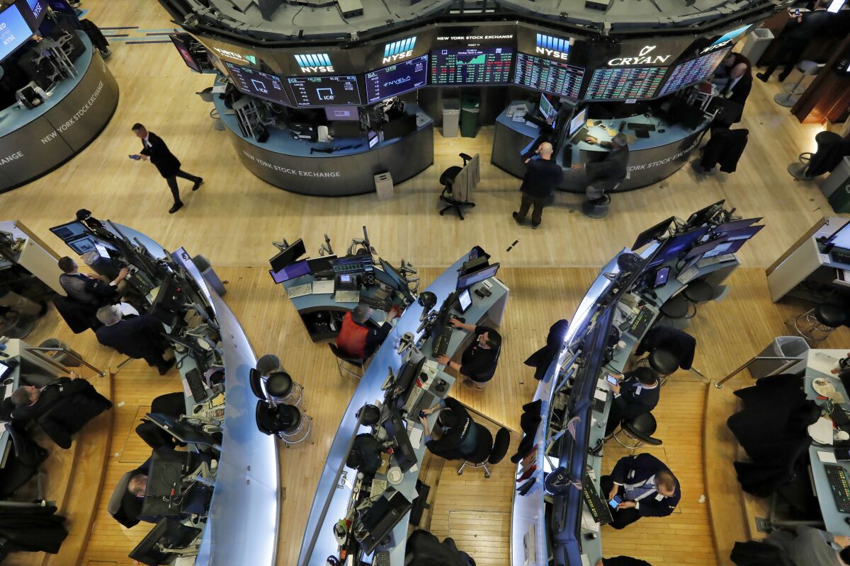 Traders work on the floor of the New York Stock Exchange.