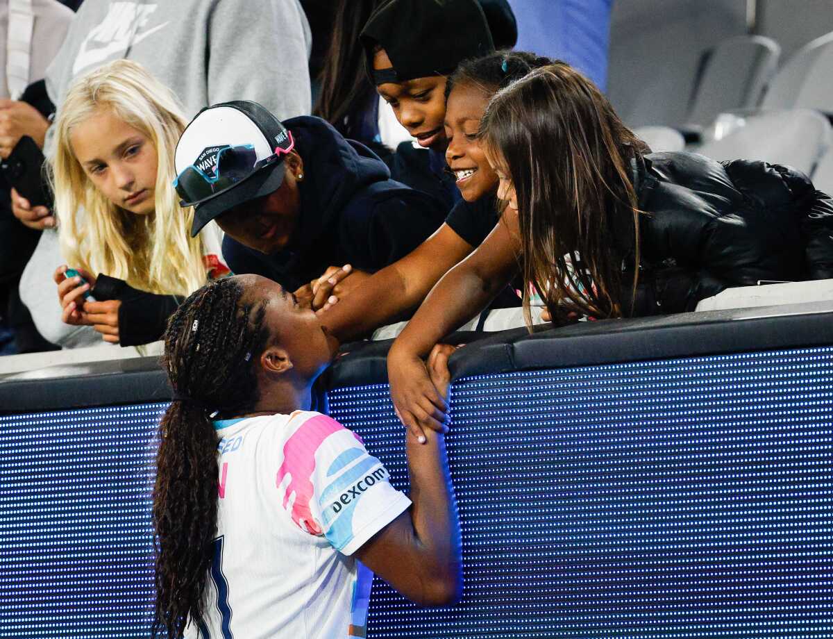 San Diego Wave FC forward Jaedyn Shaw (11) greets fans