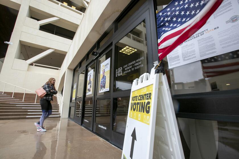 Huntington Beach, CA - November 08: A voter enters to polling place at Huntington Beach City Hall on Tuesday, Nov. 8, 2022. (Scott Smeltzer / Daily Pilot)