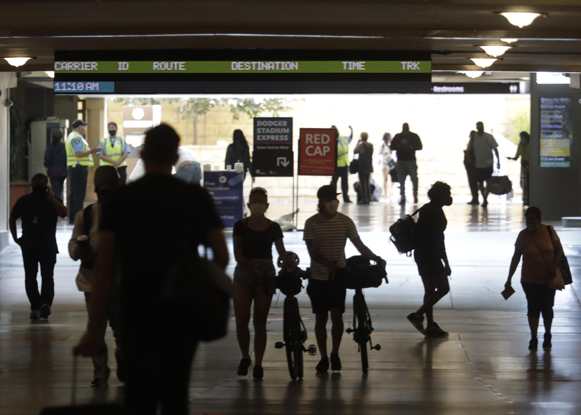 Travelers make their way through Union Station.