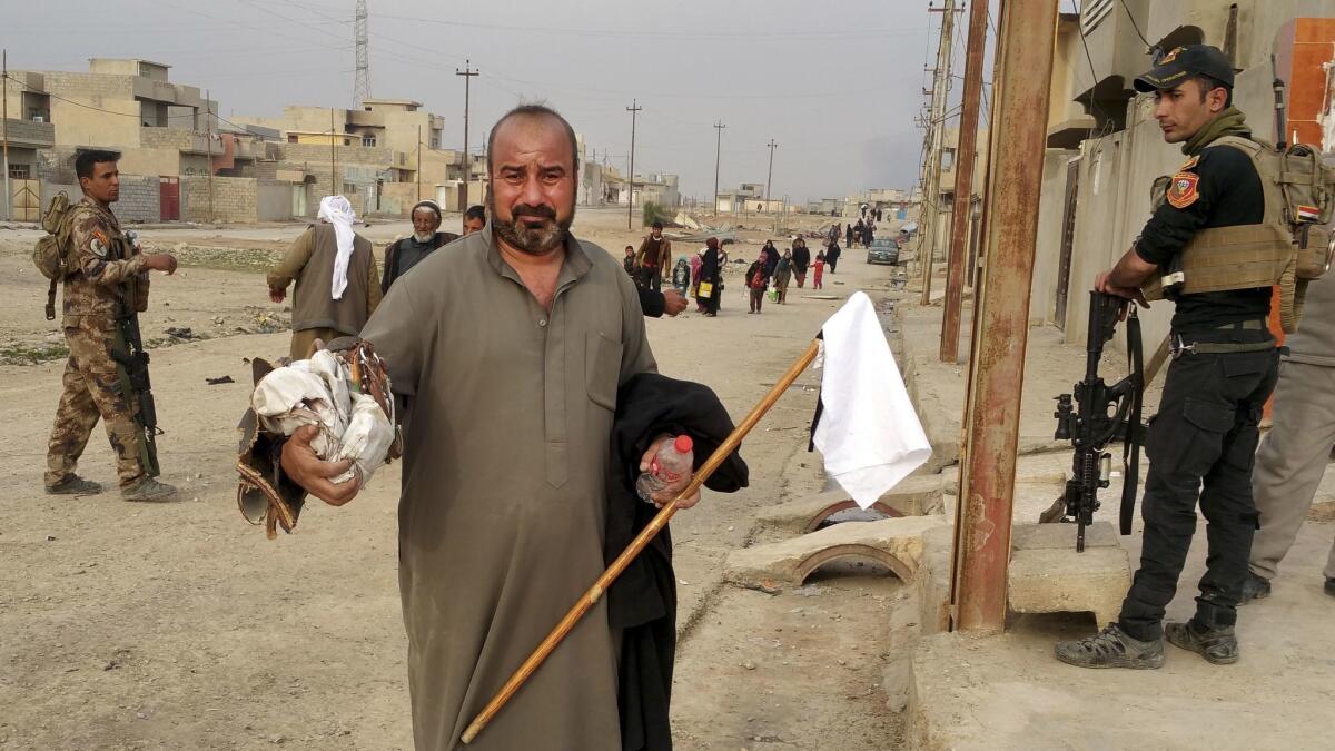Abu Barazan Hadidi, a 43-year-old taxi driver who just buried his daughter and granddaughter in a makeshift grave. They were killed by a mortar as they escaped the fighting in western Mosul.