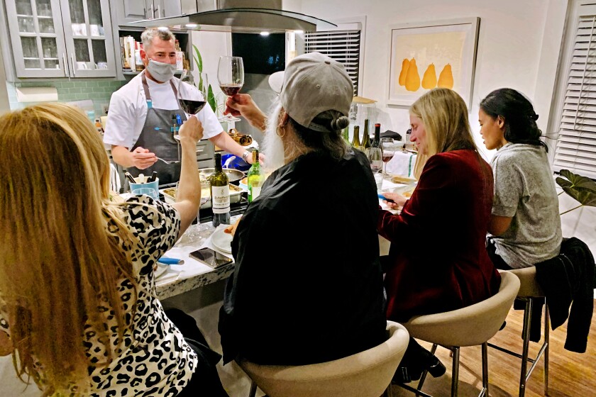 Kevin Meehan, chef-owner of Kali restaurant on Melrose Avenue, cooked a multi-course meal for a small gathering at a customer's home in December. He said the private in-home events have supplemented his takeout revenue and helped keep his business afloat during the shutdown. (Kevin Meehan)