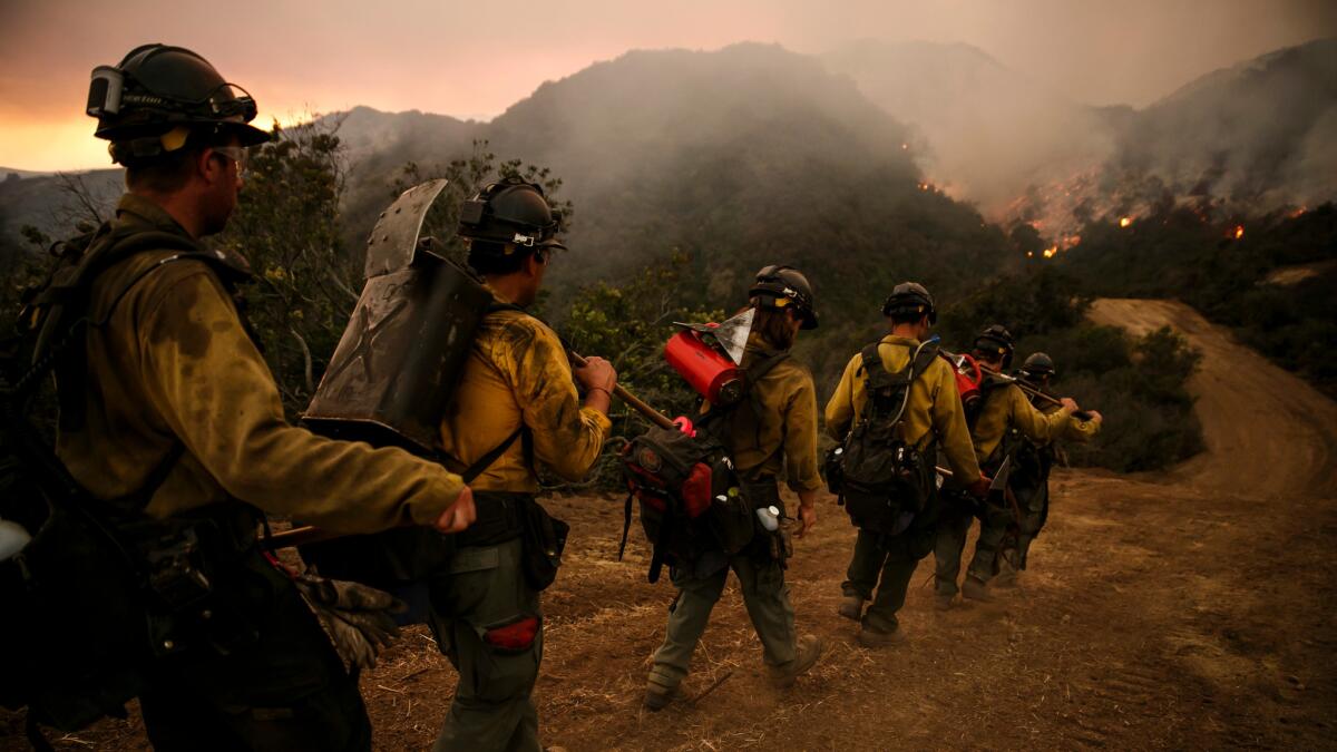 Firefighters marched into El Capitan Canyon in Santa Barbara County on Friday, trying to corral the Sherpa fire before winds pick up.