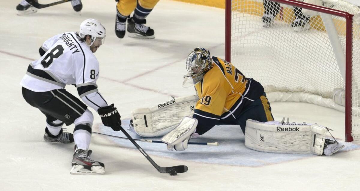 Nashville Predators goalie Marek Mazanec blocks a shot by Kings defenseman Drew Doughty.