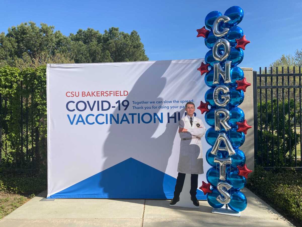 People who get vaccines can pose with a cutout of Dr. Anthony Fauci at the CSU Bakersfield vaccination site in Bakersfield.