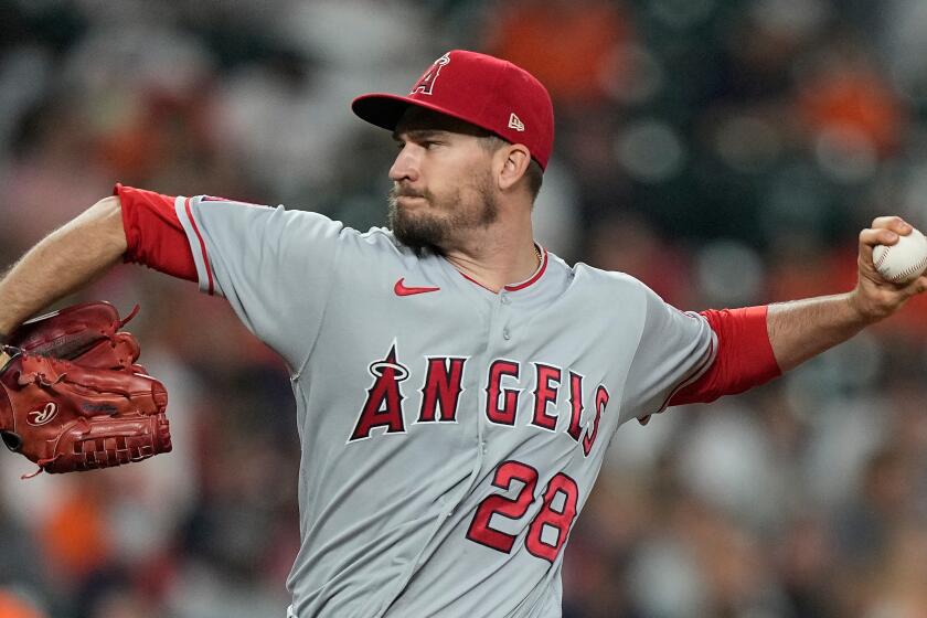 Los Angeles Angels starting pitcher Andrew Heaney throws against the Houston Astros during the first inning of a baseball game Friday, April 23, 2021, in Houston. (AP Photo/David J. Phillip)