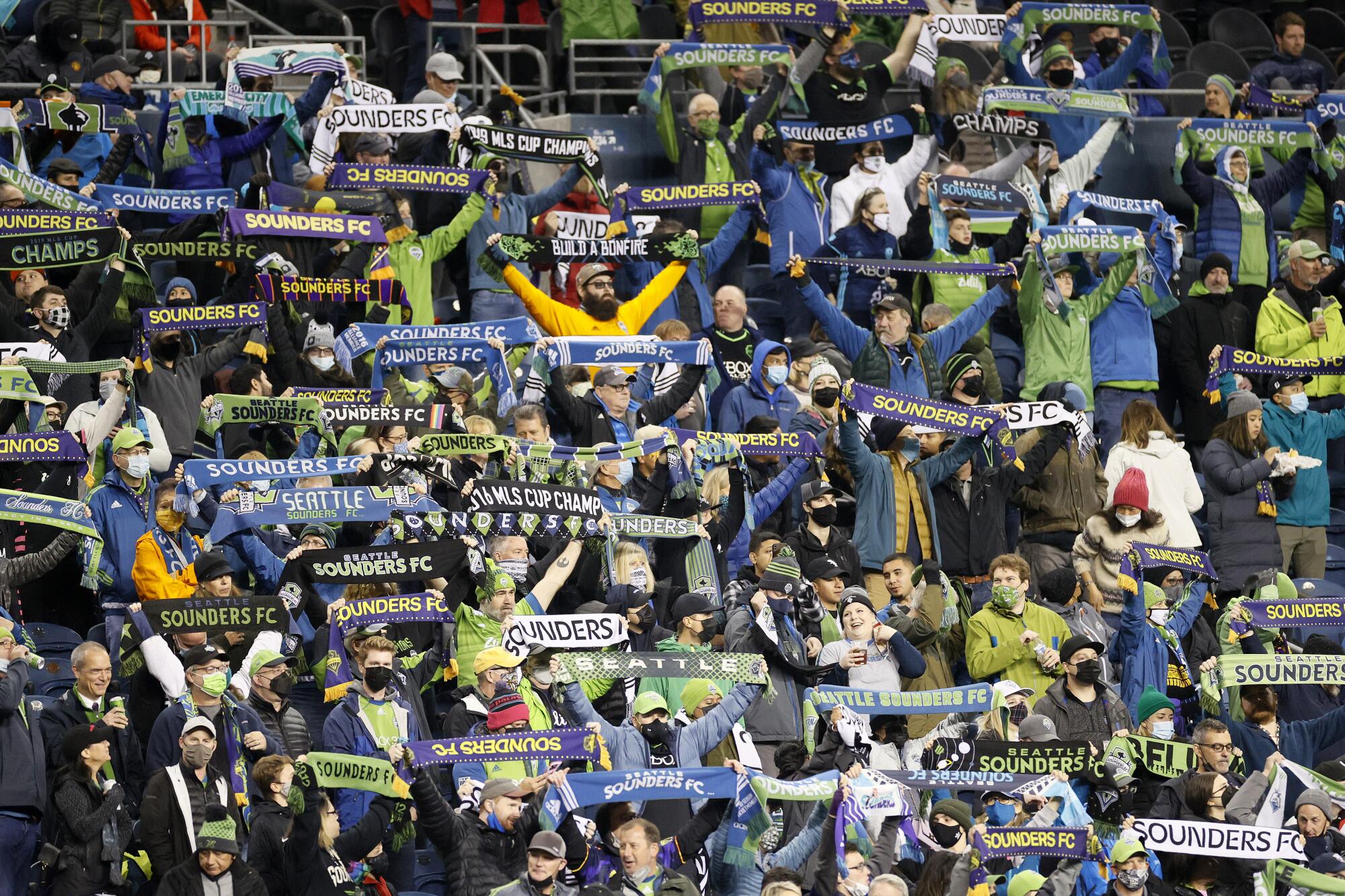 Sounders fans cheer before a game against LAFC at Lumen Field earlier this season.