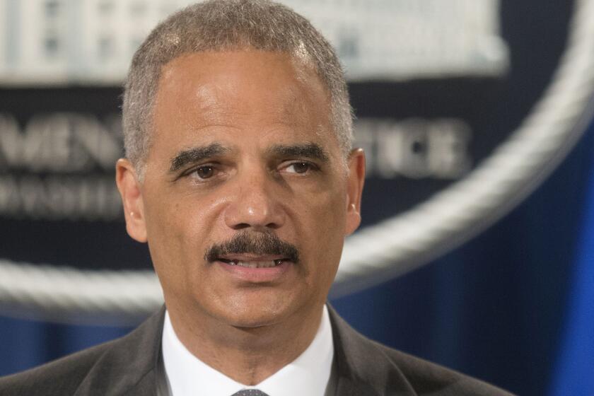 "I am deeply concerned that the deployment of military equipment and vehicles sends a conflicting message," Atty. Gen. Eric Holder said of the situation in Ferguson, Mo.