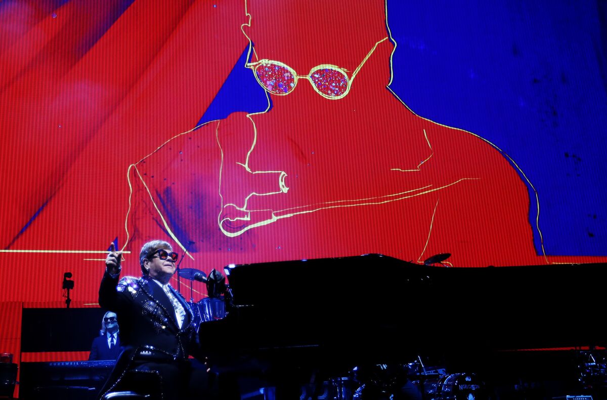 Elton John opens his performance with a fan-favorite, "Bennie and the Jets."
