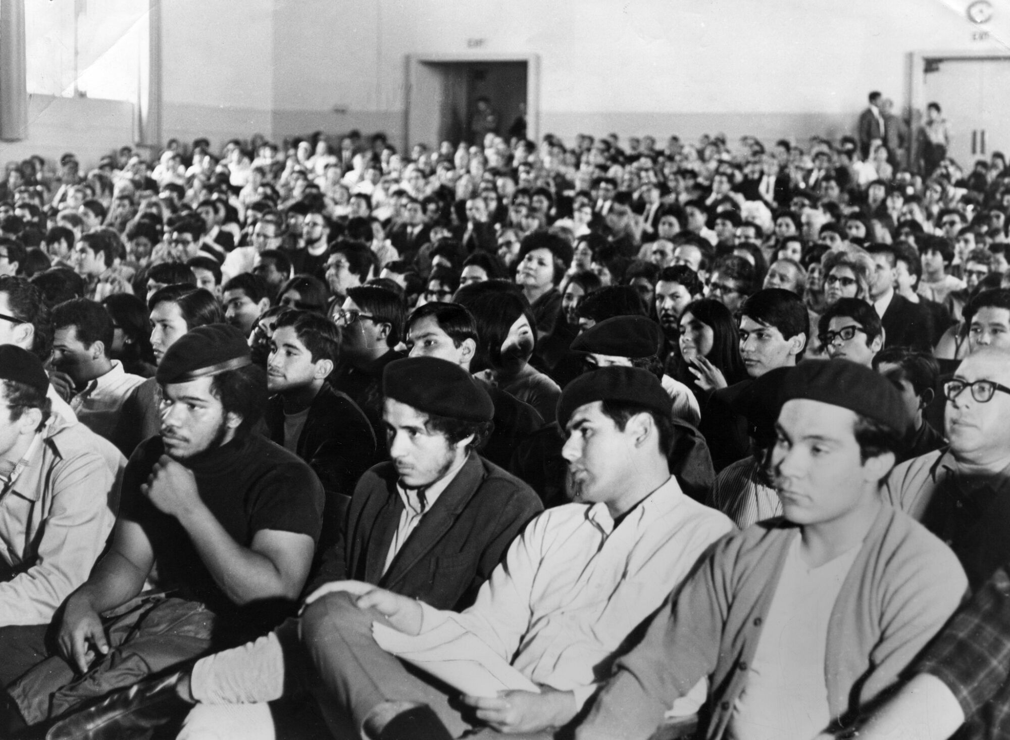 Members of the Brown Berets listen to a speaker on June 9, 1968, in a crowded auditorium
