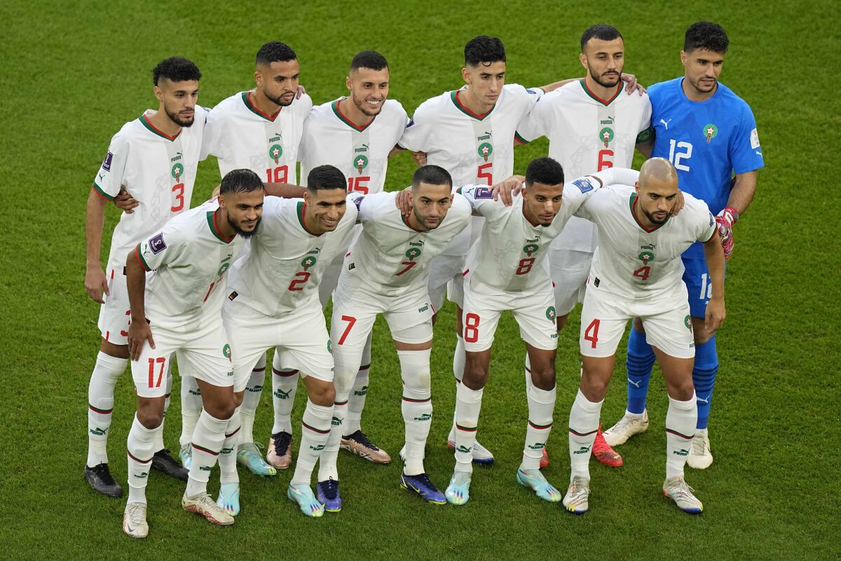 Morocco players pose to the start of the World Cup group F soccer match between Belgium and Morocco, at the Al Thumama Stadium in Doha, Qatar, Sunday, Nov. 27, 2022. (AP Photo/Pavel Golovkin)