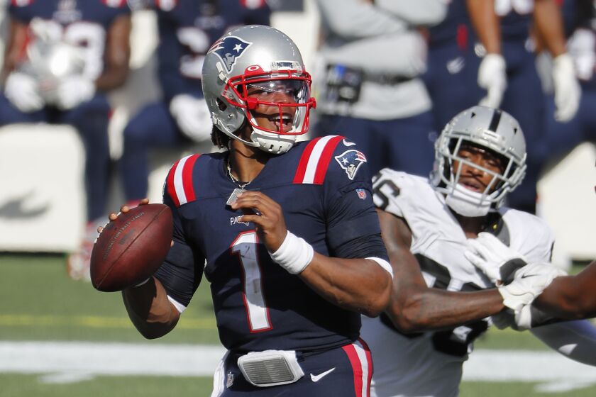 New England Patriots quarterback Cam Newton looks to pass against the Las Vegas Raiders.